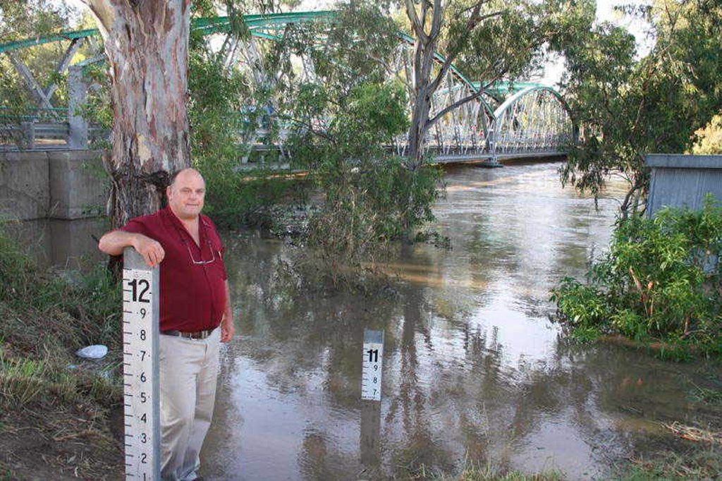 Goondiwindi Mayor Graeme Scheu near the banks of the Macintyre River in 2011 during major flooding. The river is expected to peak much lower at minor flood level at midday. Goondiwindi Mayor Graeme Scheu near the banks of the Macintyre River in 2011 during major flooding. The river is expected to peak much lower at minor flood level at midday.